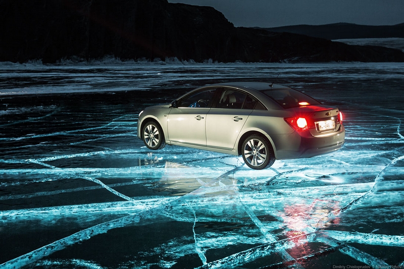 Car on Ice At Night Illuminated from Underwater
